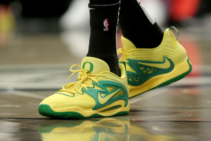 View of Kevin Durant's yellow and green shoes.